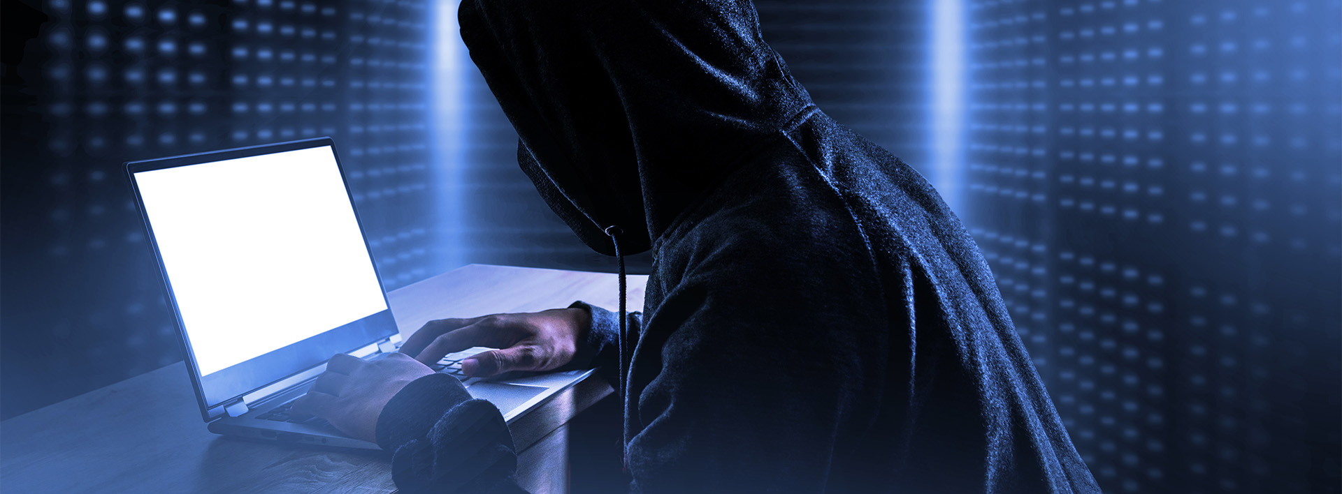 Cybercrime hacking and technology crime hacker with laptop