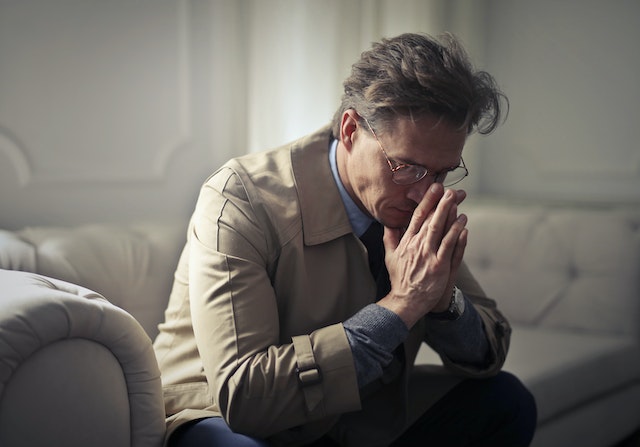 stressed man with glasses