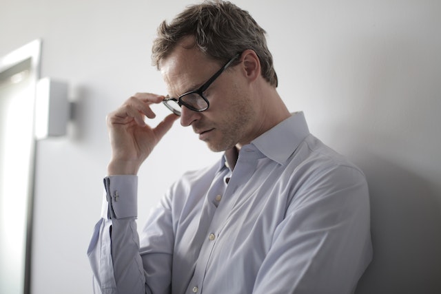 stressed man with glasses