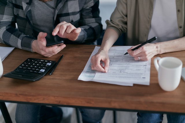 two people reviewing documents