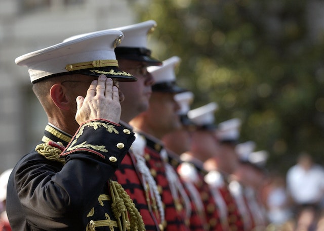 Men in uniforms saluting