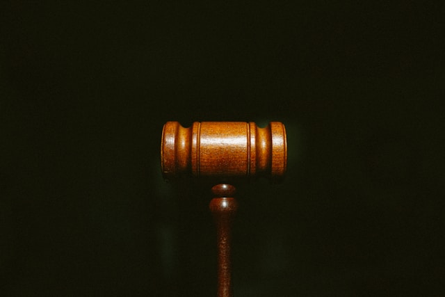 brown gavel on black background